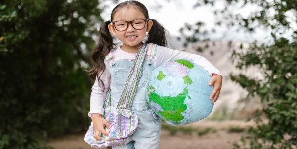 Kid with a globe
